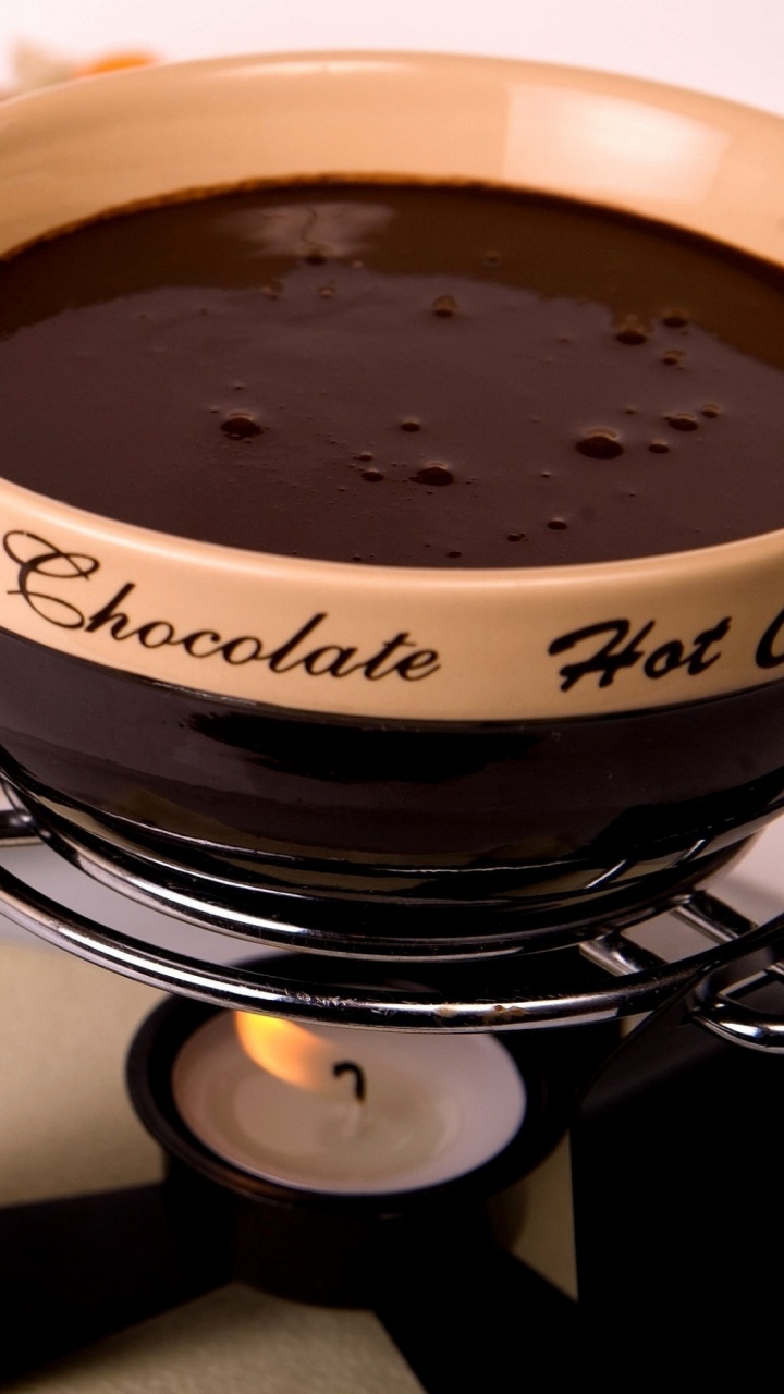 White and Black Ceramic Bowl With Sliced Strawberries. Wallpaper in 720x1280 Resolution