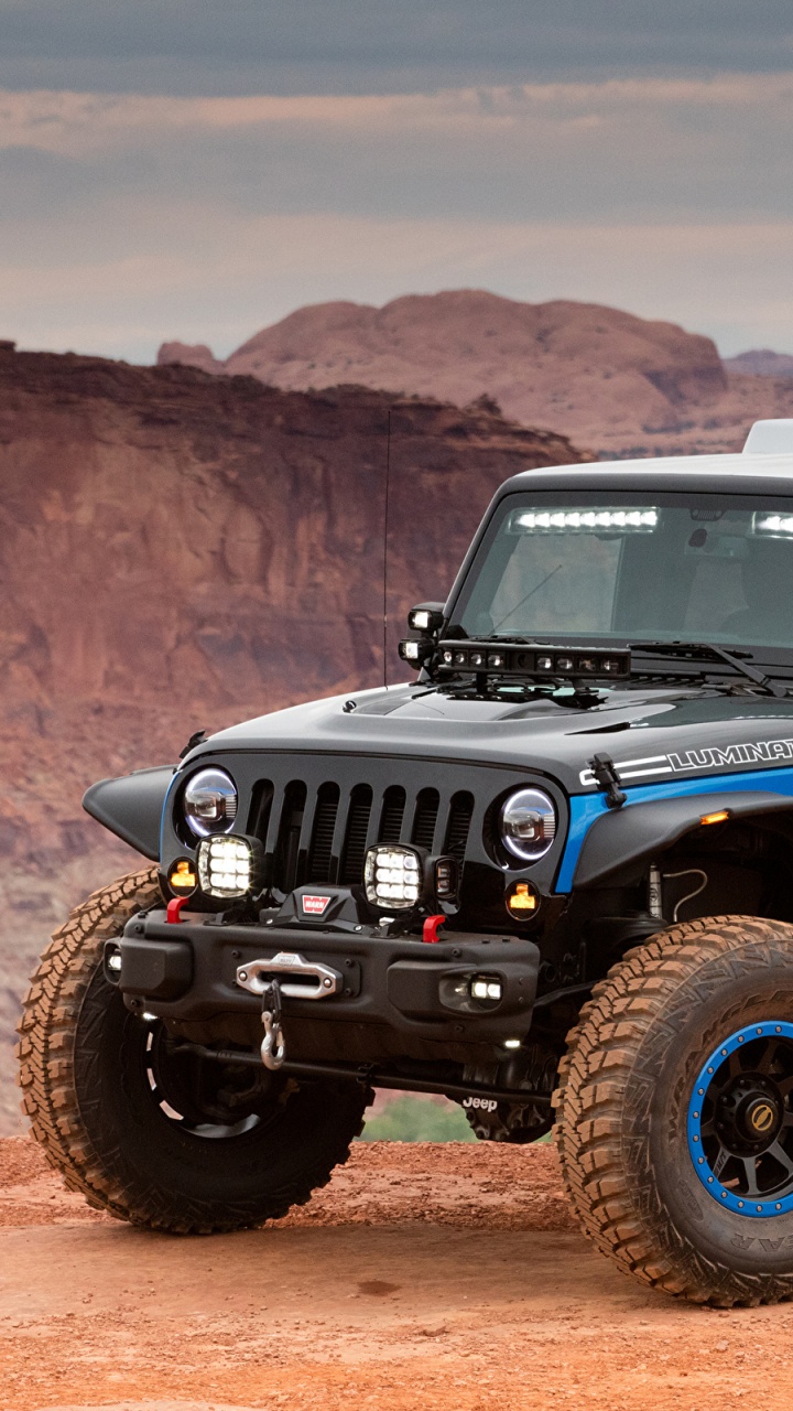 Blue Jeep Wrangler on Dirt Road During Daytime. Wallpaper in 720x1280 Resolution