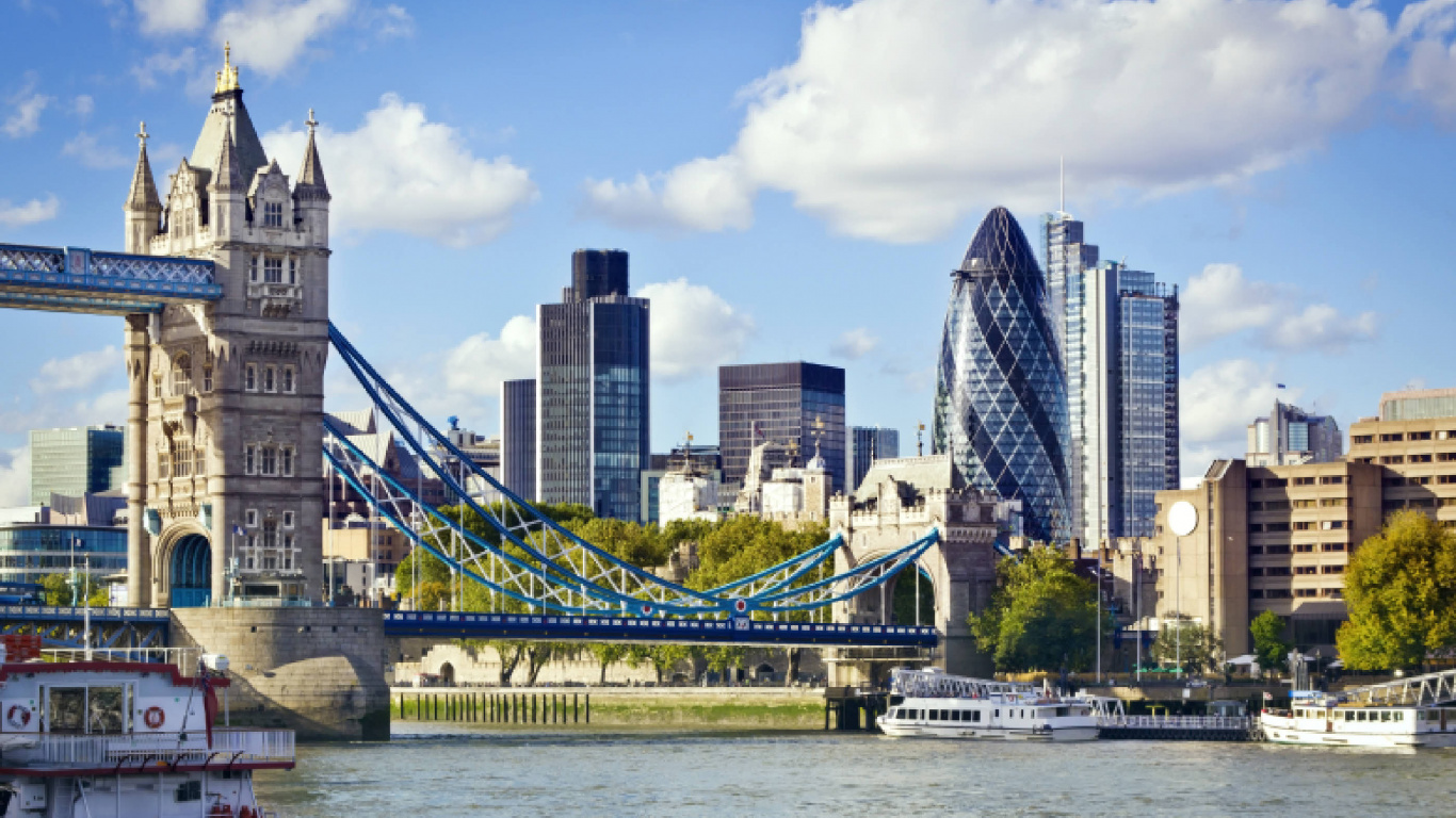 White and Blue Bridge Over Water Near City Buildings During Daytime. Wallpaper in 1366x768 Resolution