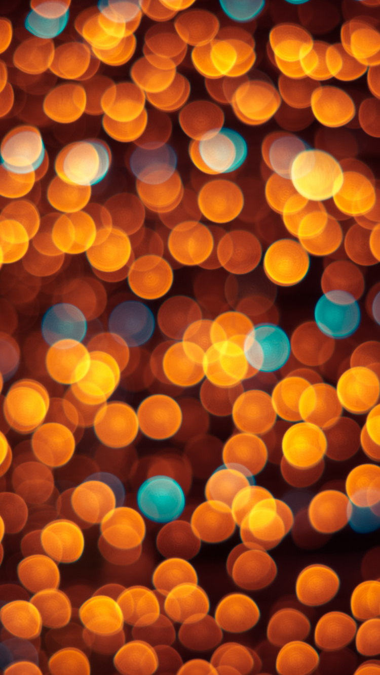 Orange Bokeh Lights During Night Time. Wallpaper in 750x1334 Resolution