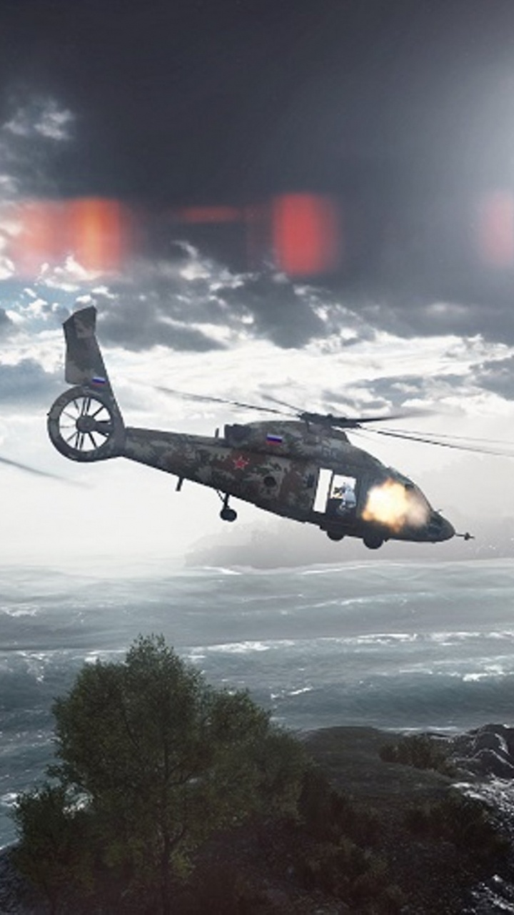 Hélicoptère Noir Survolant la Mer Pendant la Journée. Wallpaper in 720x1280 Resolution