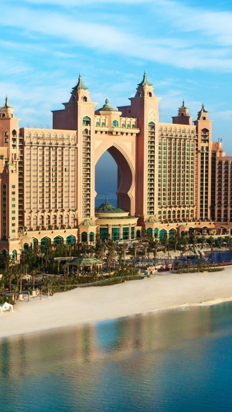 People on Beach Near High Rise Buildings During Daytime. Wallpaper in 750x1334 Resolution