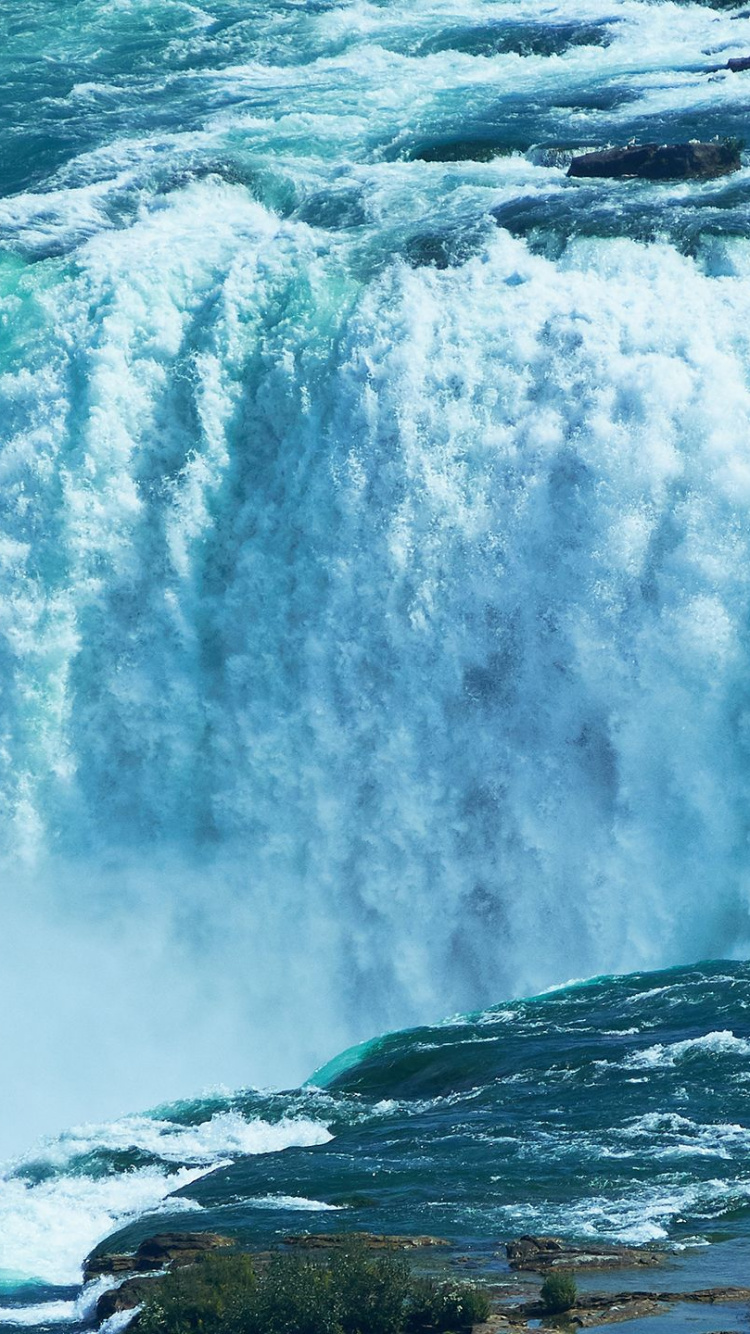 Water Falls on Rocky Shore During Daytime. Wallpaper in 750x1334 Resolution