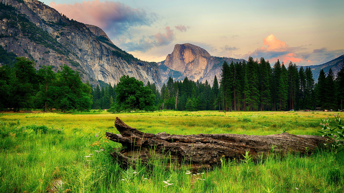 Green Grass Field Near Mountain Under White Sky During Daytime. Wallpaper in 1366x768 Resolution