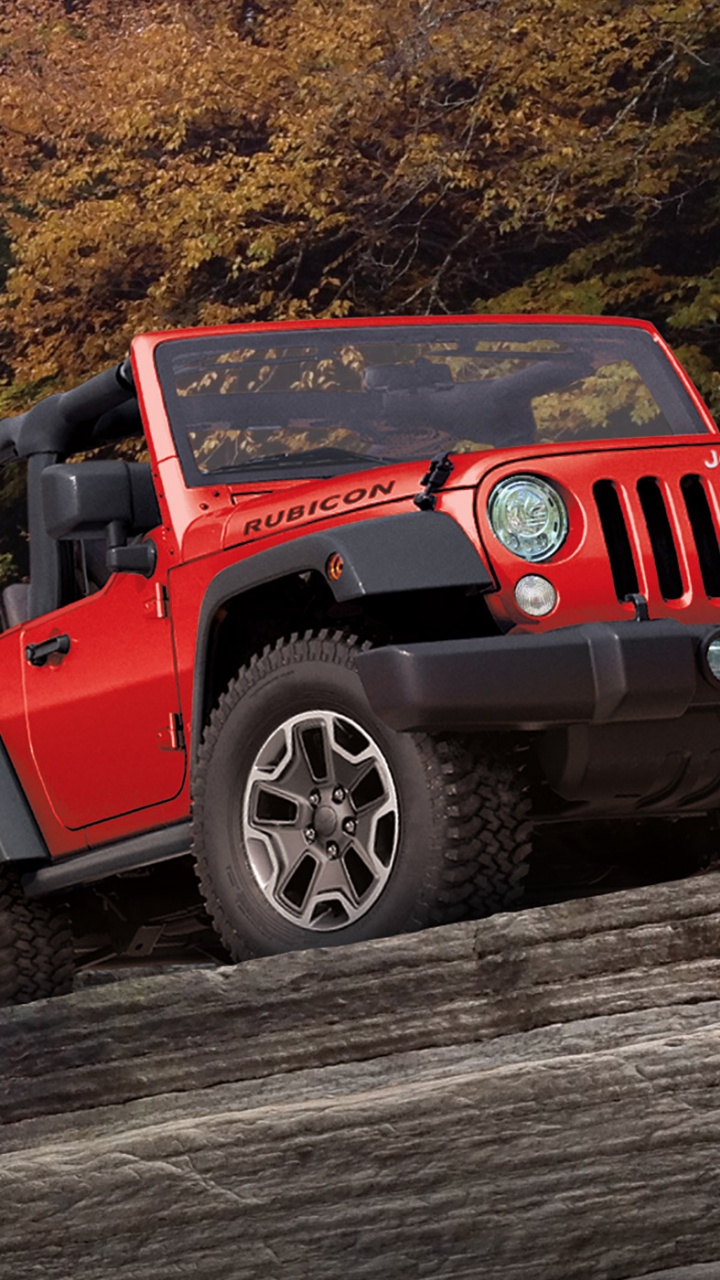 Jeep Wrangler Rouge Sur Chemin de Terre Pendant la Journée. Wallpaper in 720x1280 Resolution