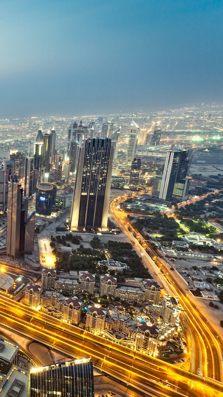 Aerial View of City Buildings During Night Time. Wallpaper in 750x1334 Resolution