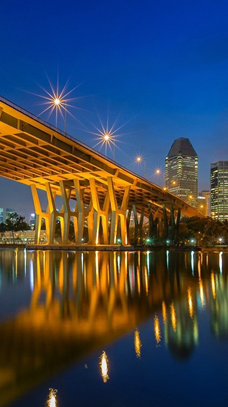 White Bridge Over Water During Night Time. Wallpaper in 750x1334 Resolution
