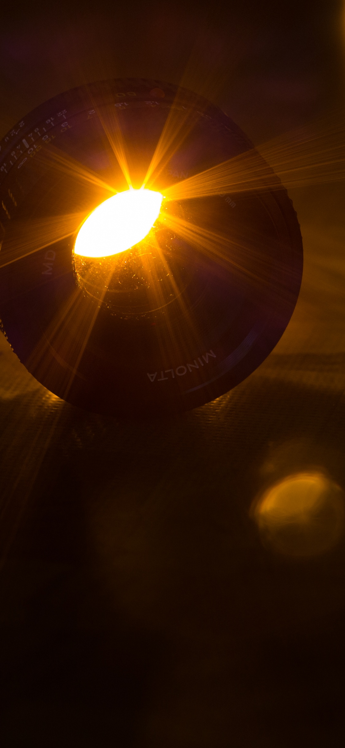 Black and White Ball on Brown Wooden Table. Wallpaper in 1125x2436 Resolution
