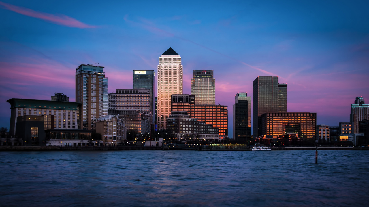 City Skyline Across Body of Water During Night Time. Wallpaper in 1280x720 Resolution