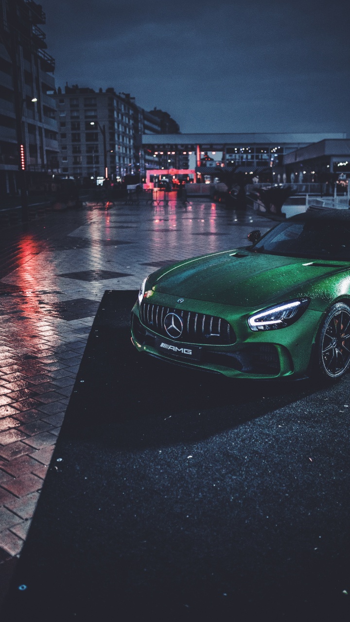 Green Mercedes Benz Coupe on Road During Night Time. Wallpaper in 720x1280 Resolution