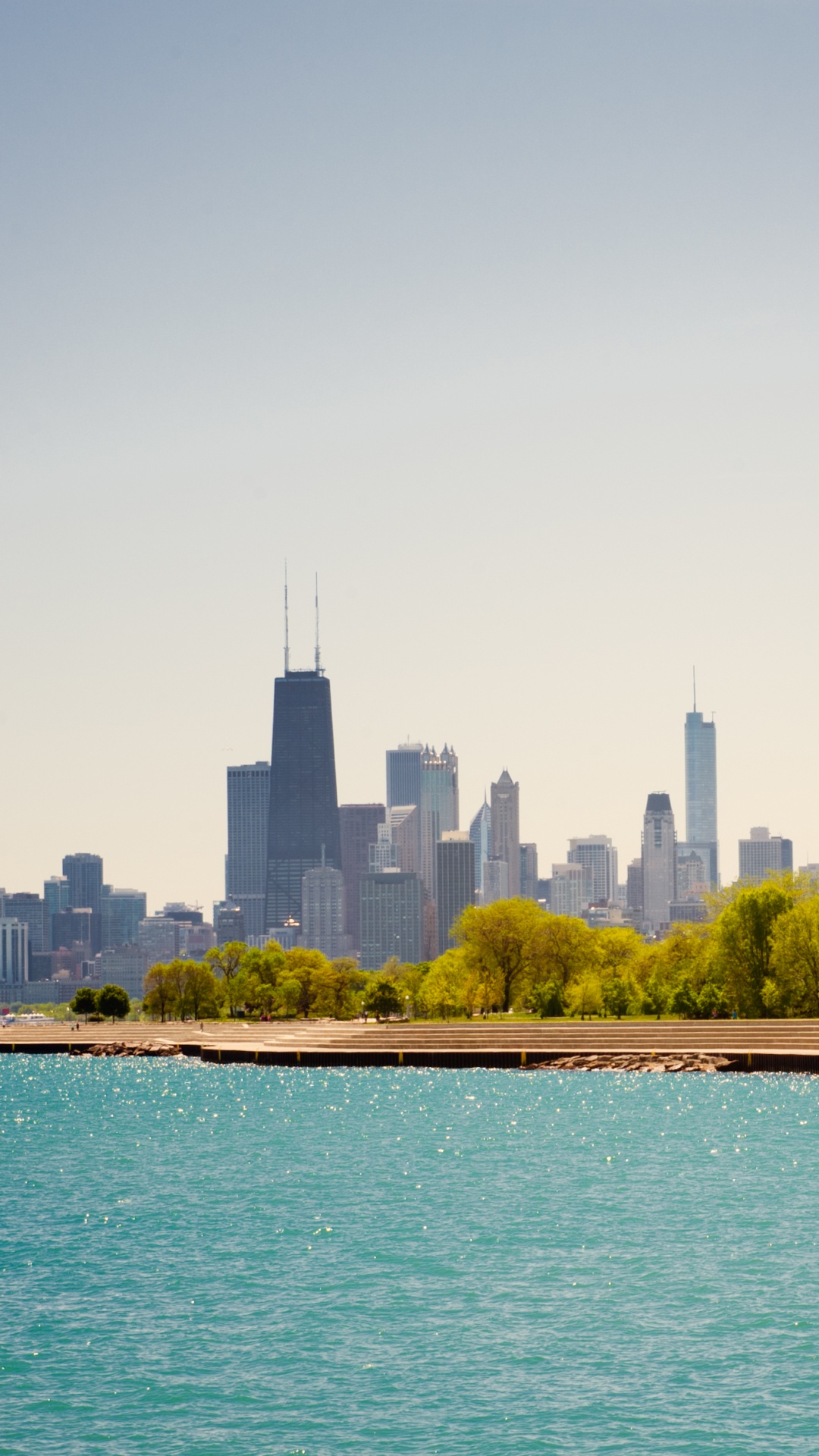 City Skyline Across Body of Water During Daytime. Wallpaper in 1080x1920 Resolution