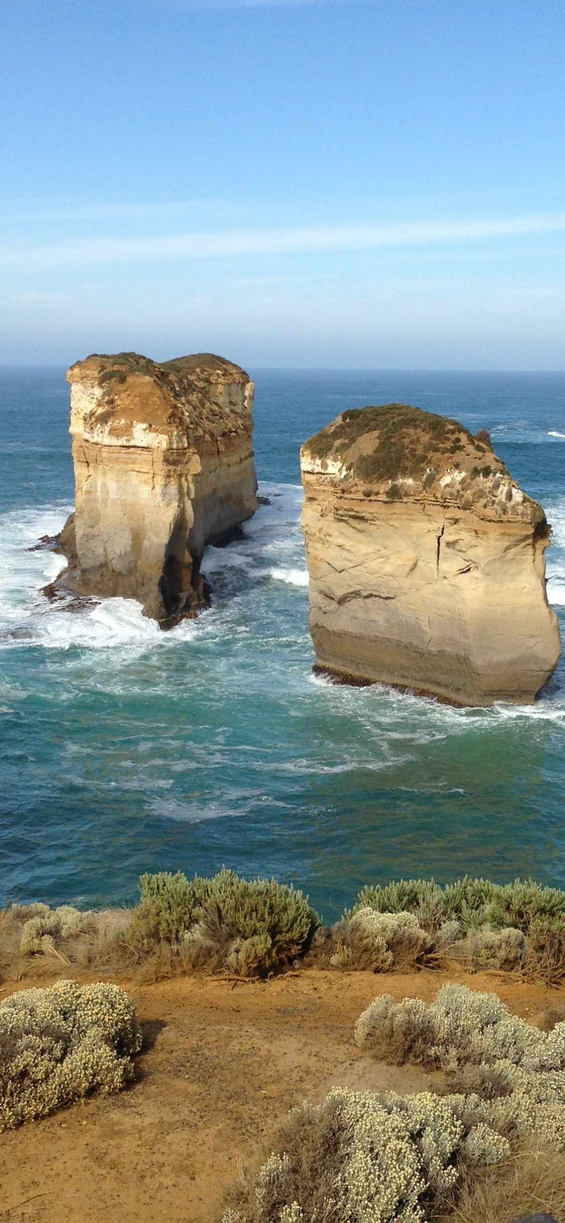 Brown Rock Formation on Sea During Daytime. Wallpaper in 1125x2436 Resolution