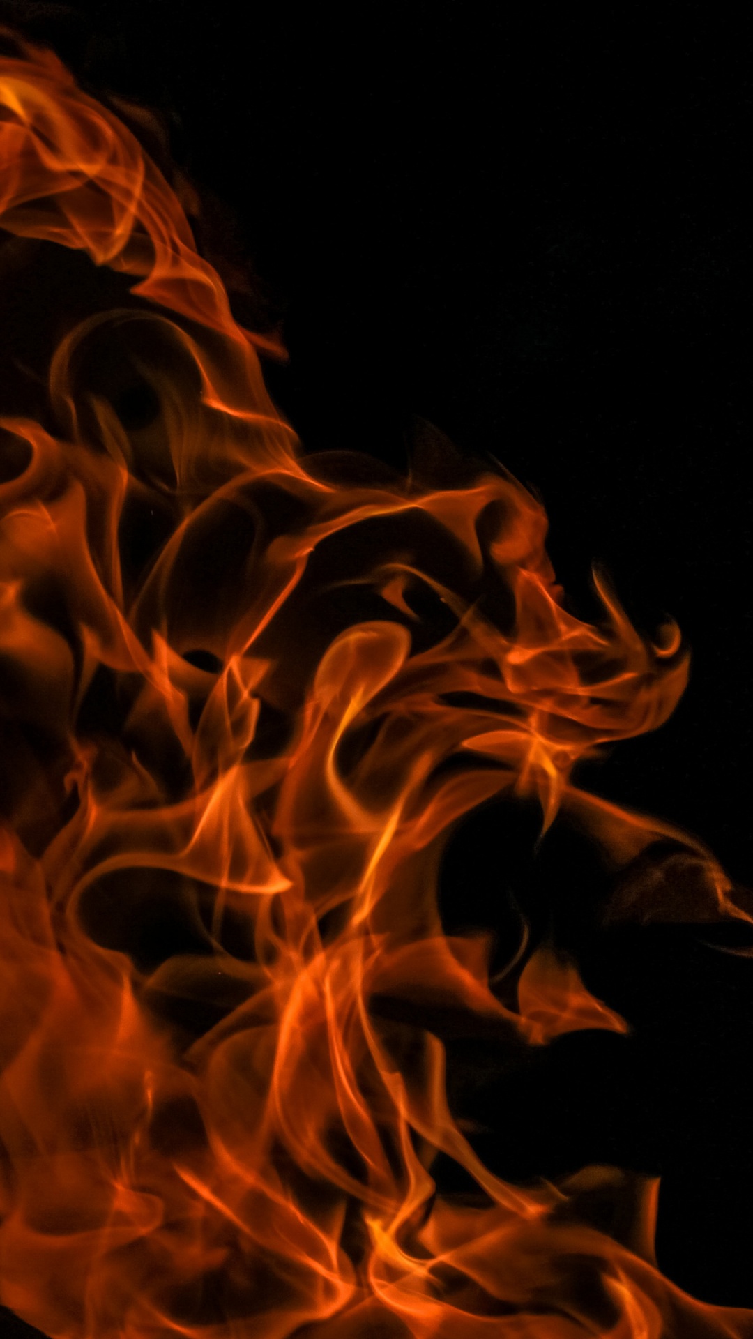 Orange Fire in Black Background. Wallpaper in 1080x1920 Resolution