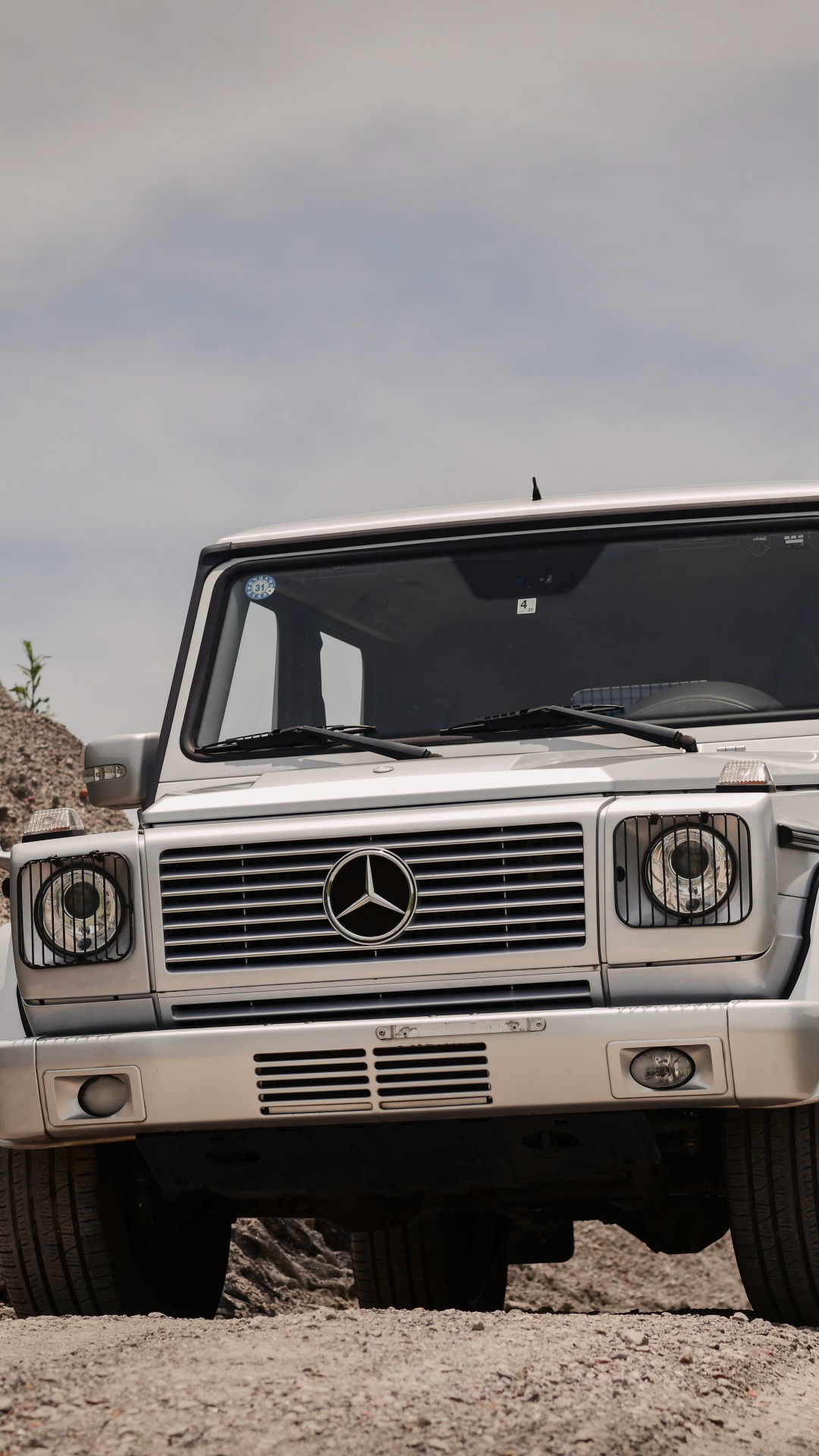White Jeep Wrangler on Brown Rocky Field Under White Cloudy Sky During Daytime. Wallpaper in 1080x1920 Resolution