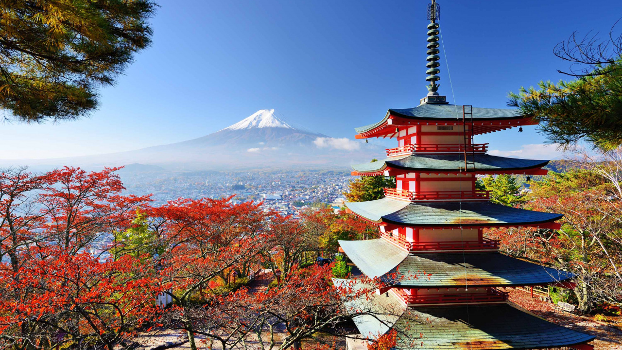 Brown and White Pagoda Temple Near Trees and Mountain Under Blue Sky During Daytime. Wallpaper in 1280x720 Resolution