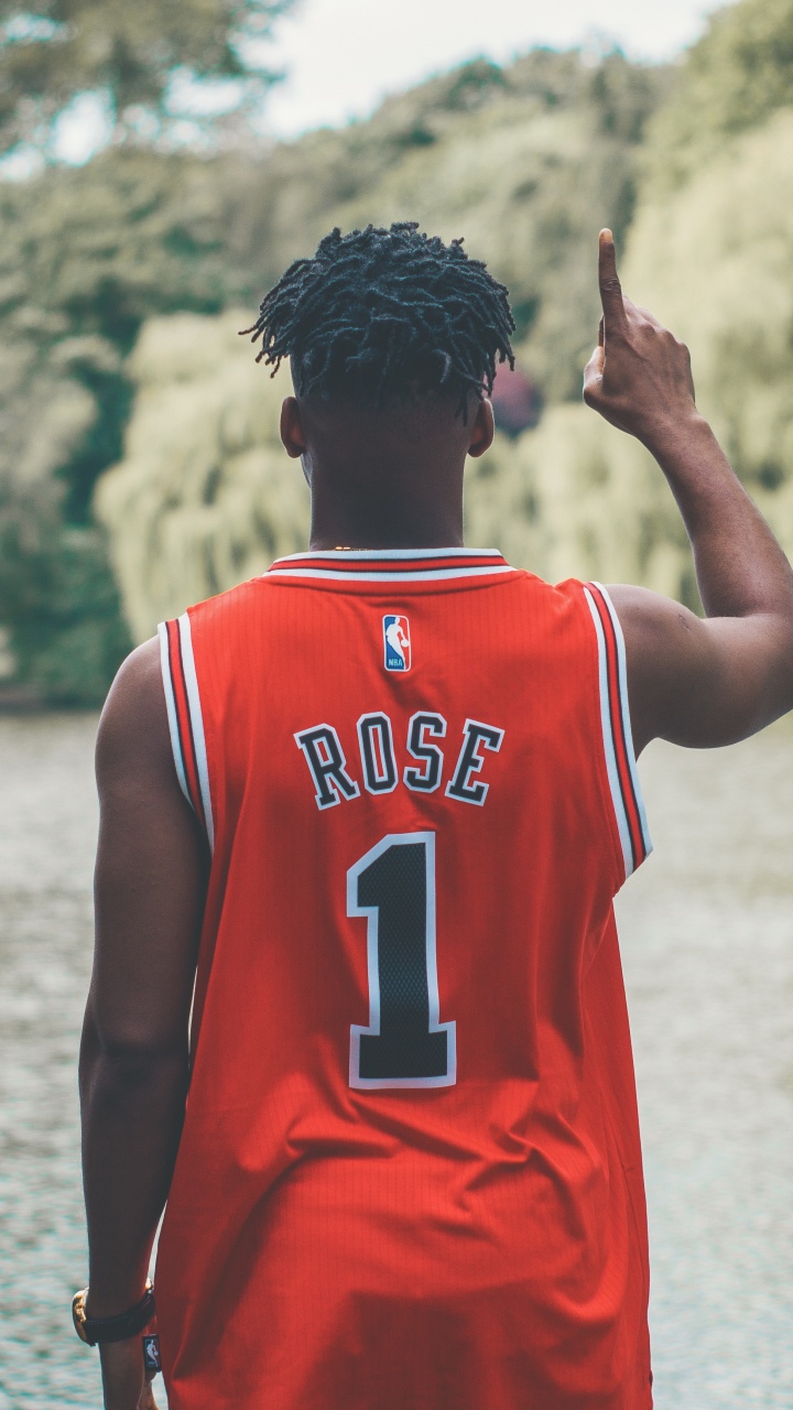 Man in Red and White Jersey Shirt Standing on Water During Daytime. Wallpaper in 720x1280 Resolution