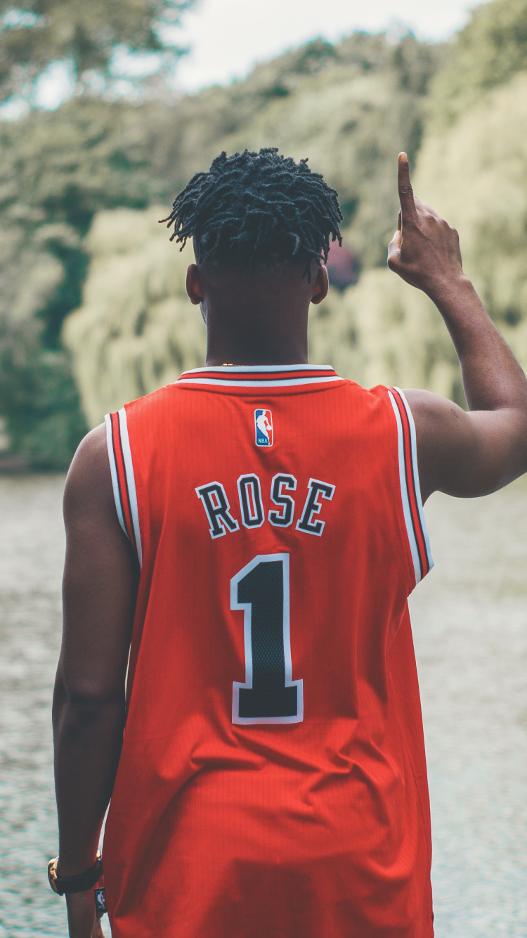 Man in Red and White Jersey Shirt Standing on Water During Daytime. Wallpaper in 750x1334 Resolution