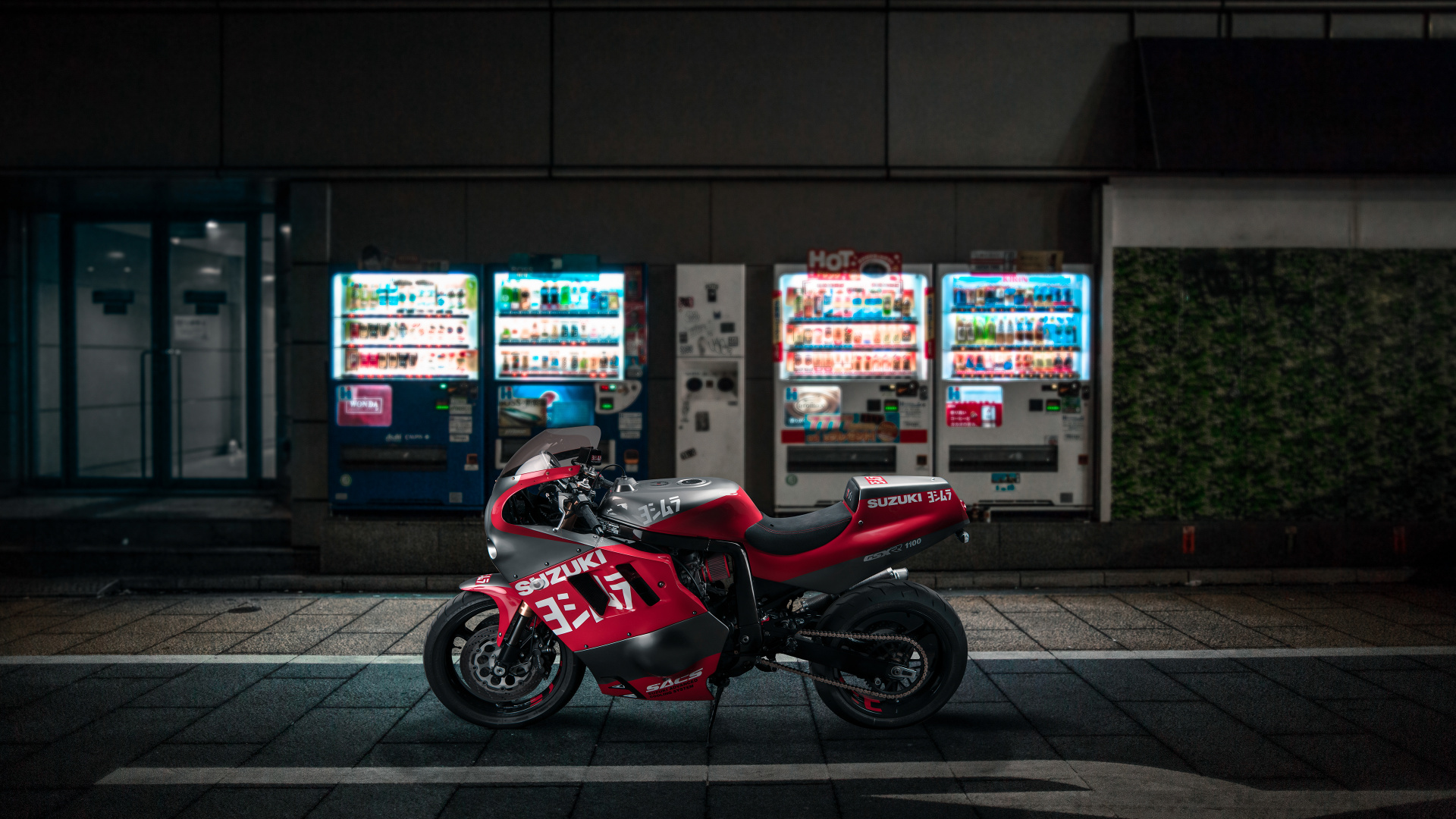 Red and Black Sports Bike Parked on Sidewalk During Nighttime. Wallpaper in 1920x1080 Resolution