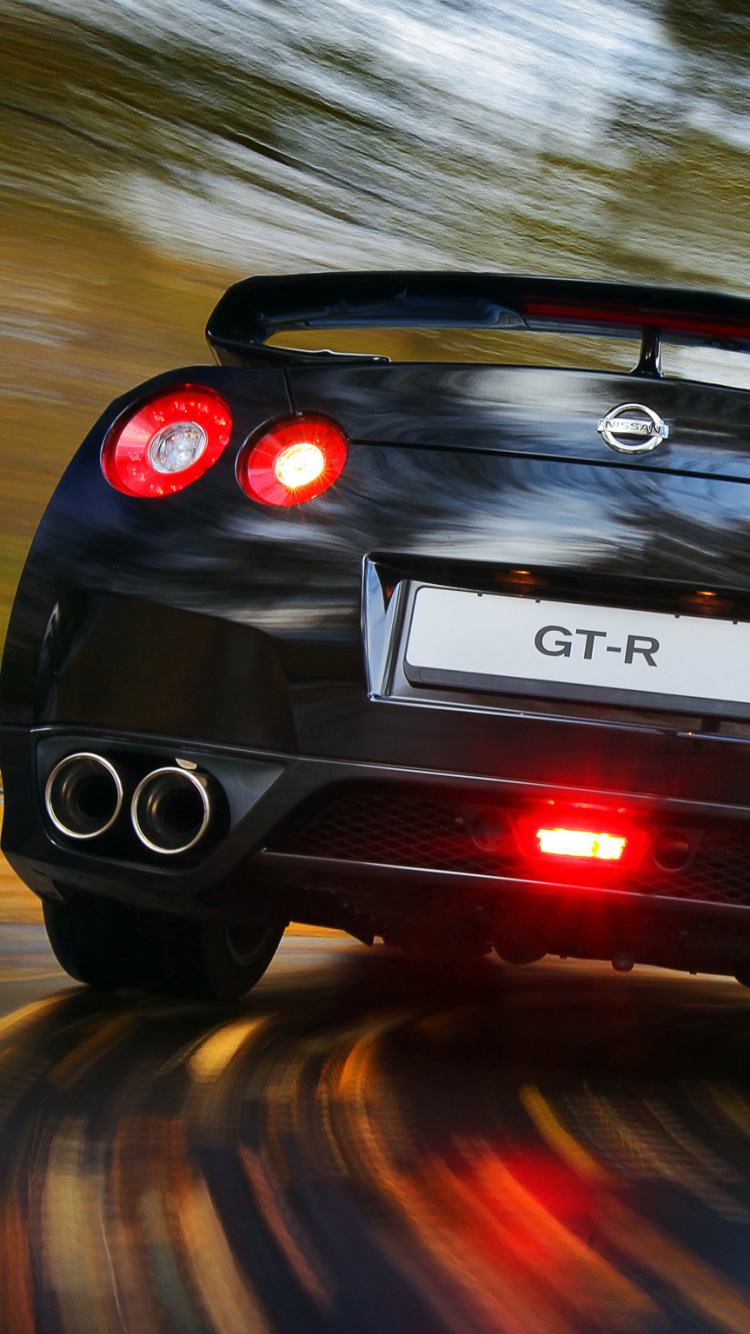 Black Porsche 911 on Road. Wallpaper in 750x1334 Resolution