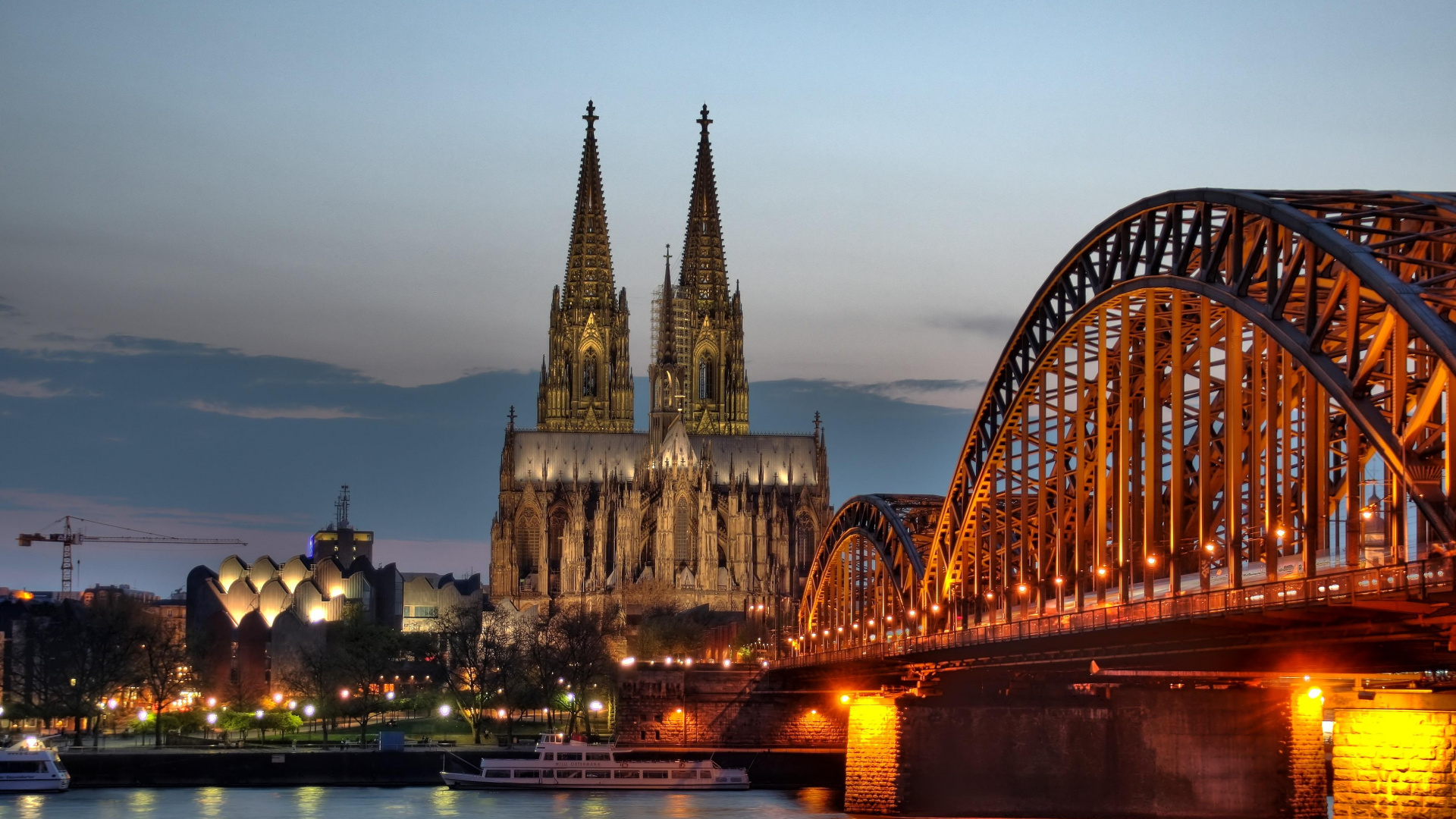 Brown Concrete Bridge Over River During Night Time. Wallpaper in 1920x1080 Resolution