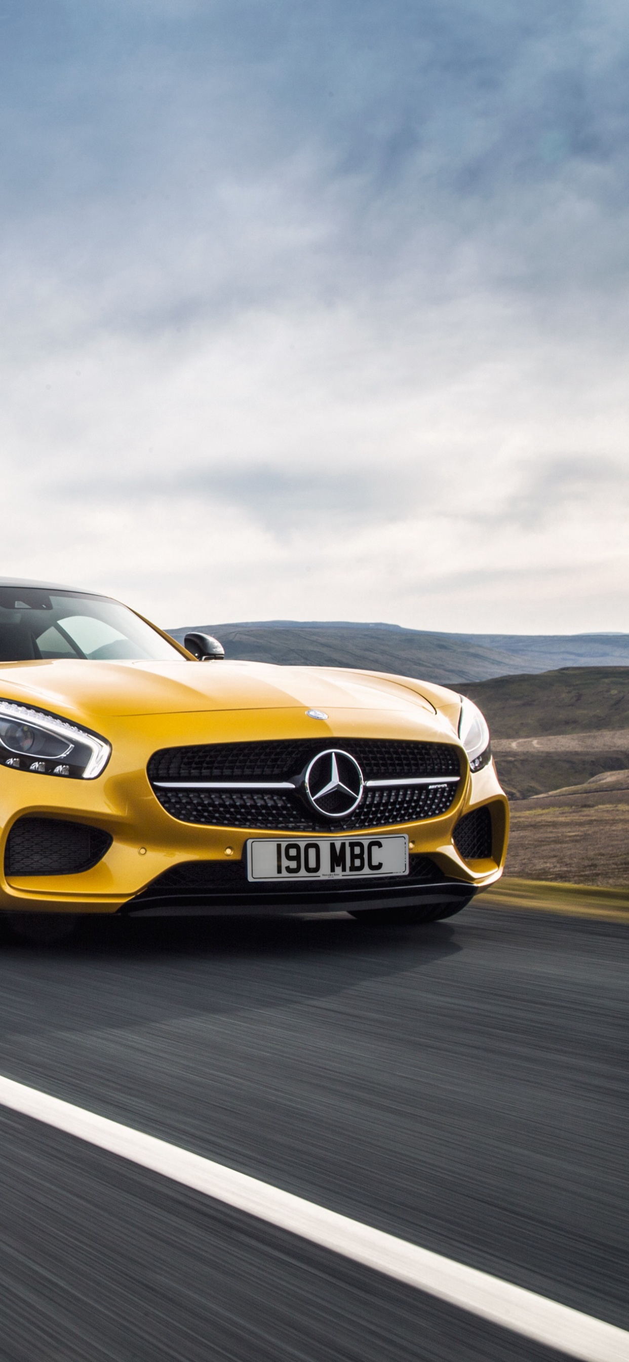 Yellow Audi Coupe on Road Under White Clouds During Daytime. Wallpaper in 1242x2688 Resolution