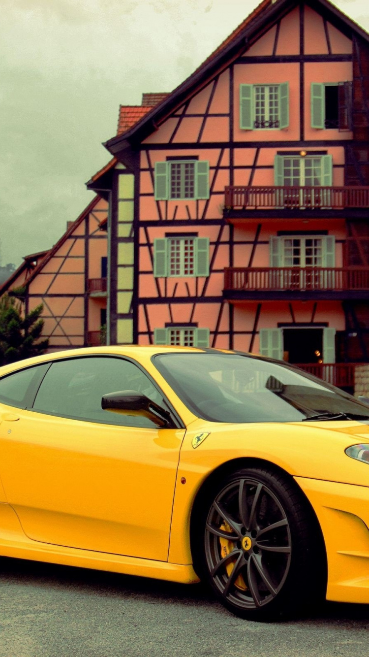 Yellow Ferrari 458 Italia Parked Beside Brown Brick Building. Wallpaper in 750x1334 Resolution