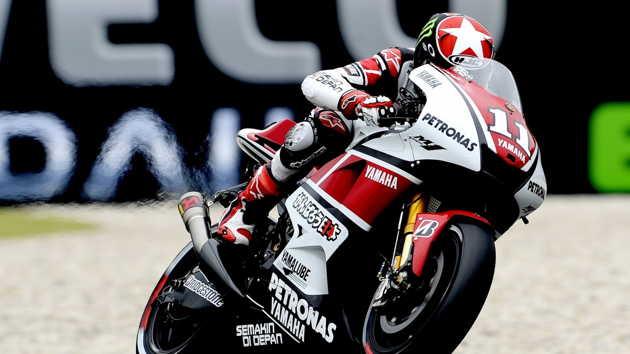 Man Riding Red and White Sports Bike. Wallpaper in 1280x720 Resolution