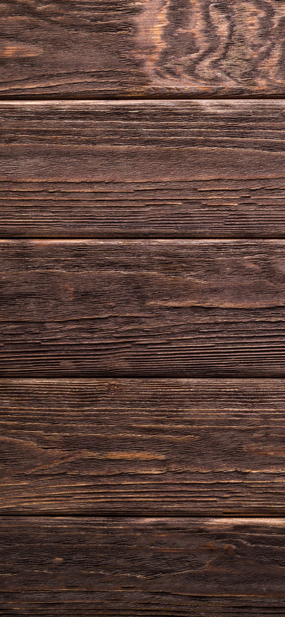 Surface en Bois Marron et Noir. Wallpaper in 1125x2436 Resolution