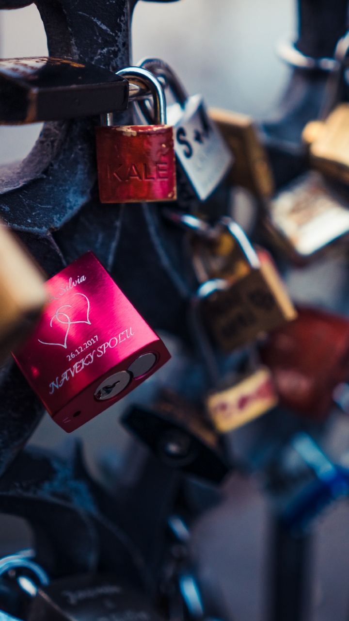 Padlocks on Black Metal Fence. Wallpaper in 720x1280 Resolution