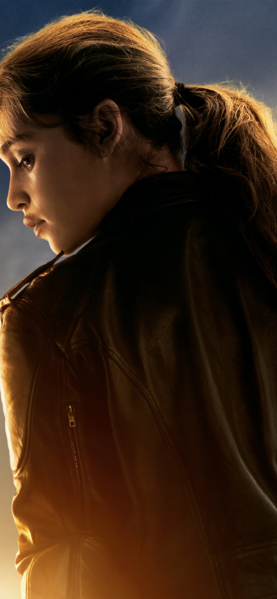 Woman in Brown Leather Jacket Under Cloudy Sky During Daytime. Wallpaper in 1125x2436 Resolution