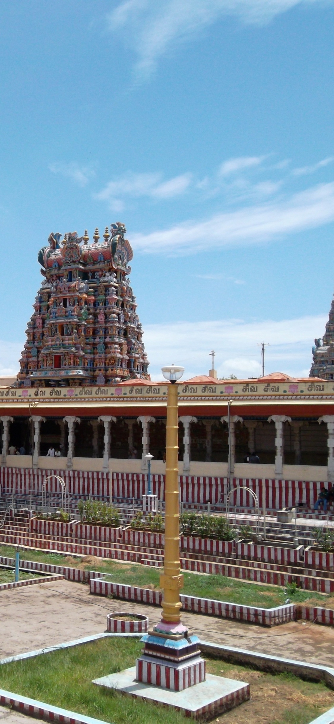 Brown Concrete Building Under Blue Sky During Daytime. Wallpaper in 1125x2436 Resolution