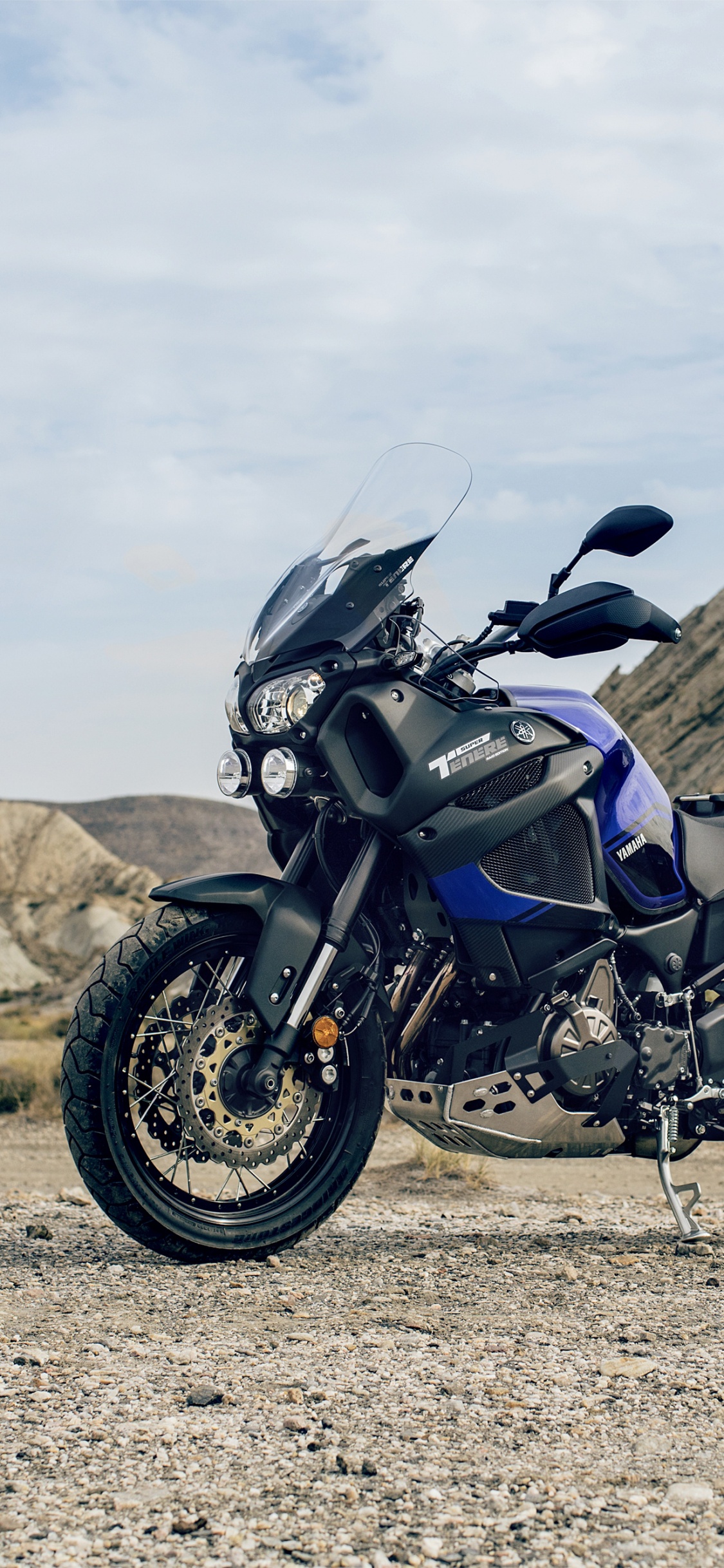 Black Motorcycle on Brown Field During Daytime. Wallpaper in 1125x2436 Resolution