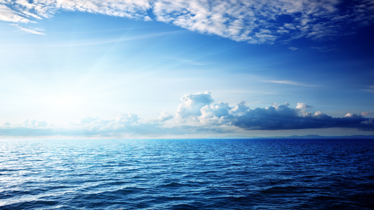 Blue Sea Under Blue Sky and White Clouds During Daytime. Wallpaper in 1280x720 Resolution