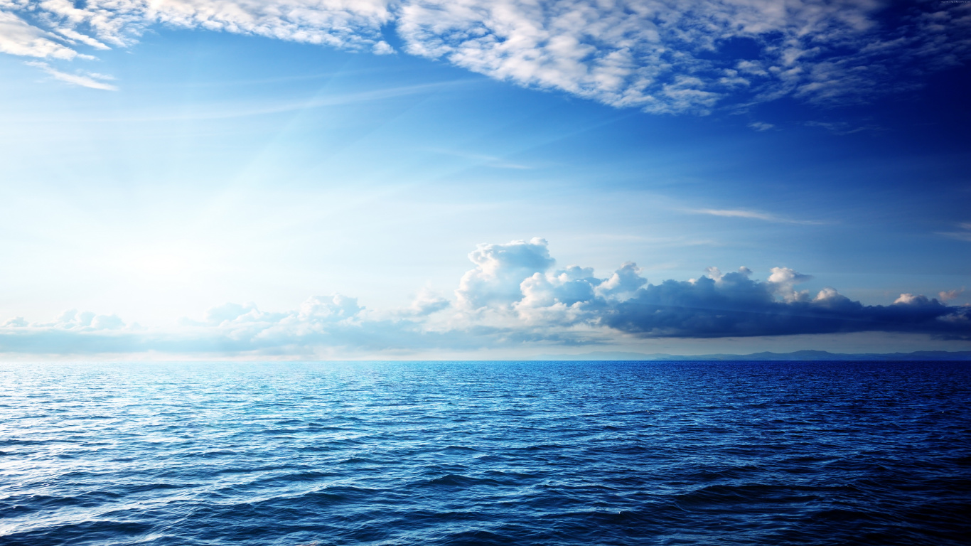 Blue Sea Under Blue Sky and White Clouds During Daytime. Wallpaper in 1366x768 Resolution