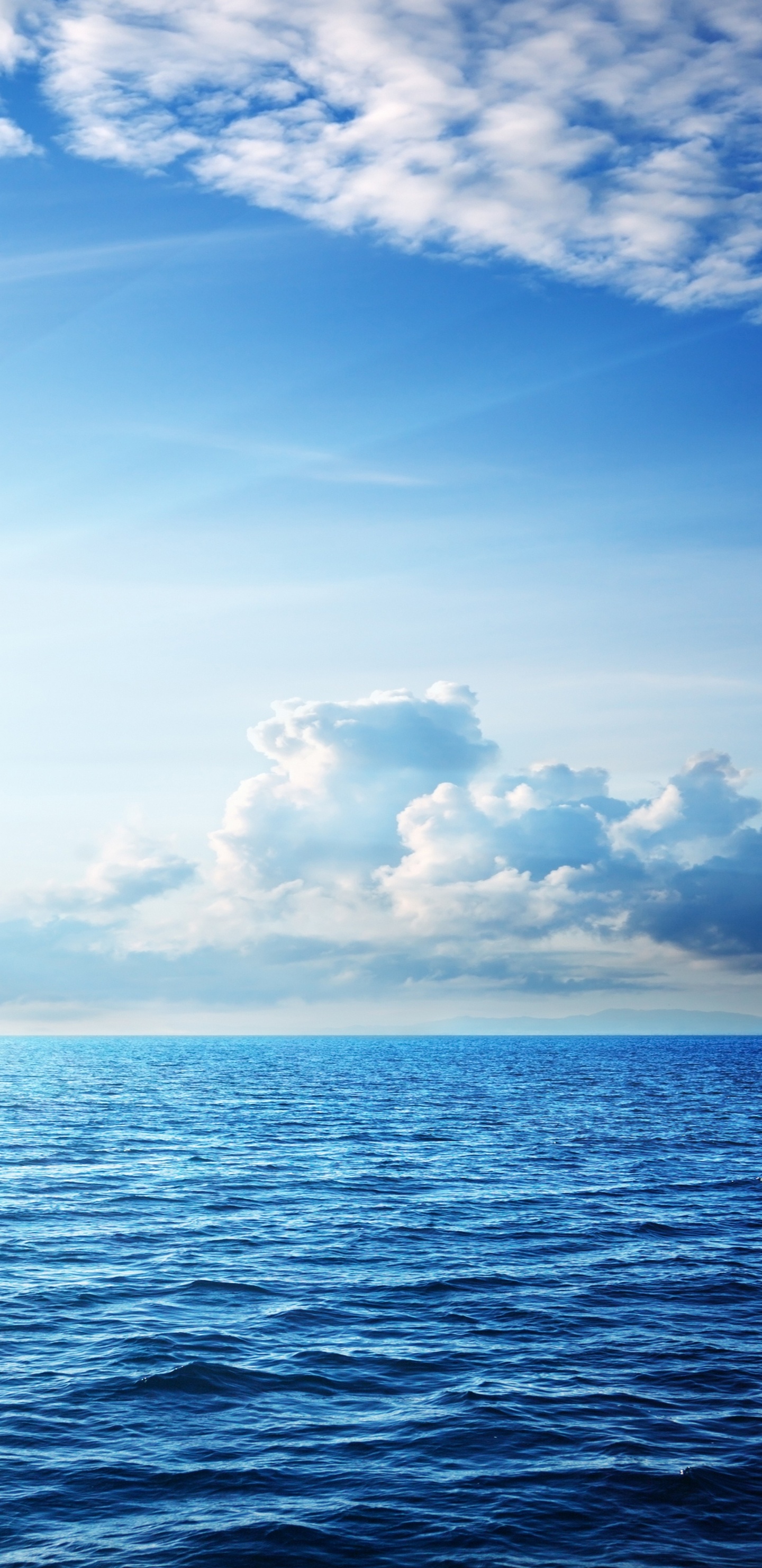 Blue Sea Under Blue Sky and White Clouds During Daytime. Wallpaper in 1440x2960 Resolution