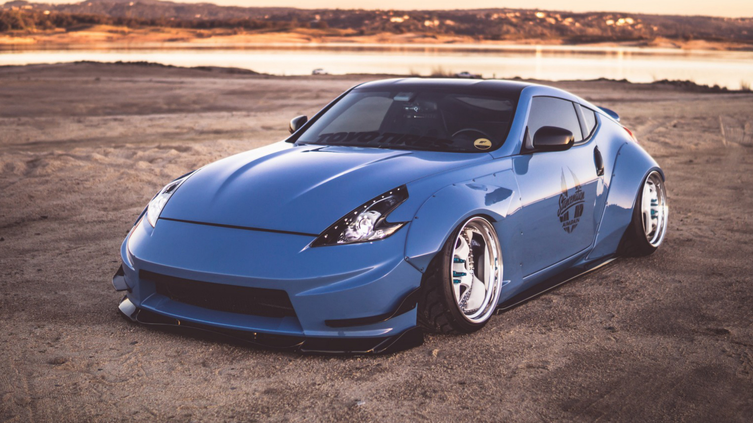 Blue Porsche 911 on Brown Sand During Daytime. Wallpaper in 2560x1440 Resolution