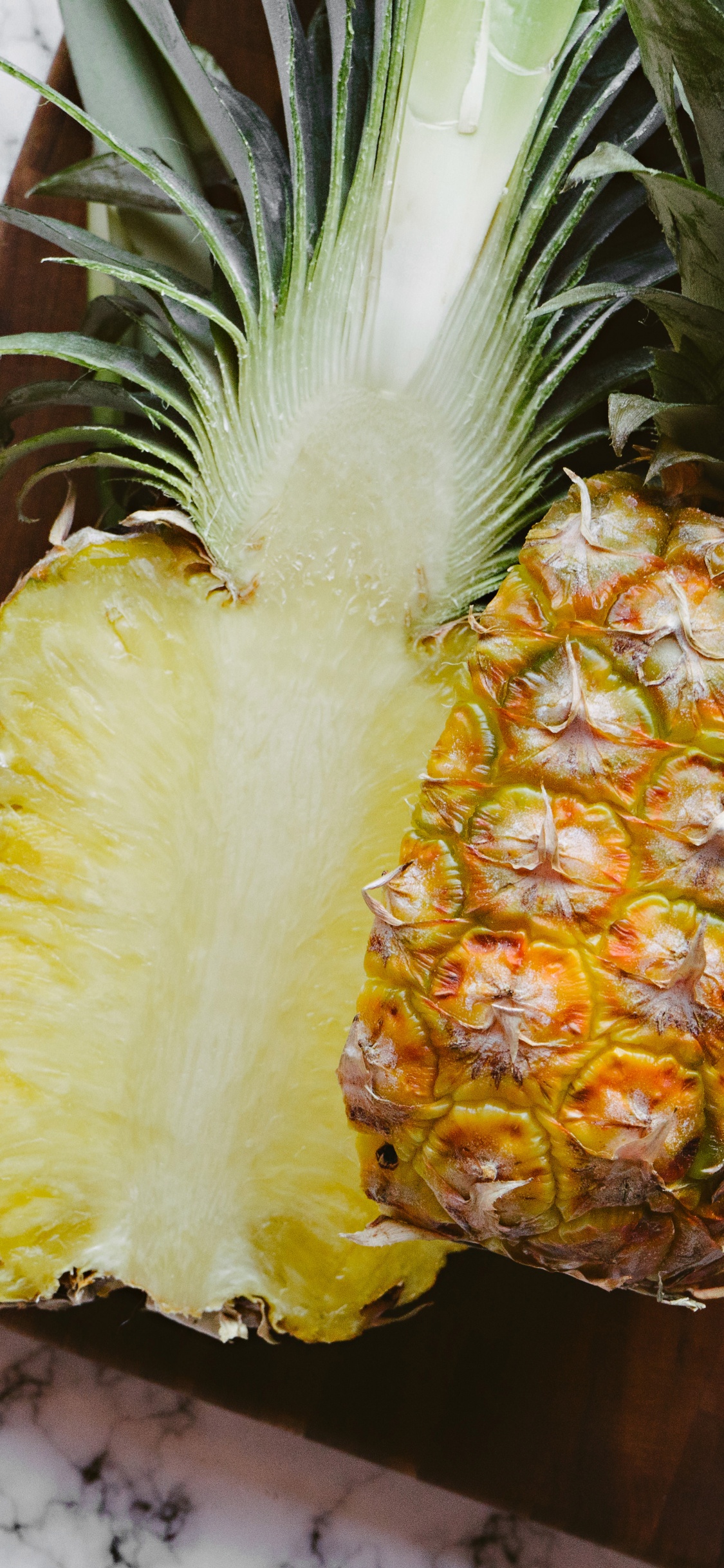 Yellow and Green Pineapple Fruit. Wallpaper in 1125x2436 Resolution