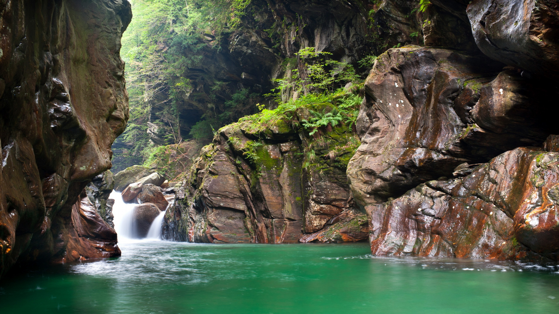 Water Falls Between Brown Rocky Mountain During Daytime. Wallpaper in 1920x1080 Resolution