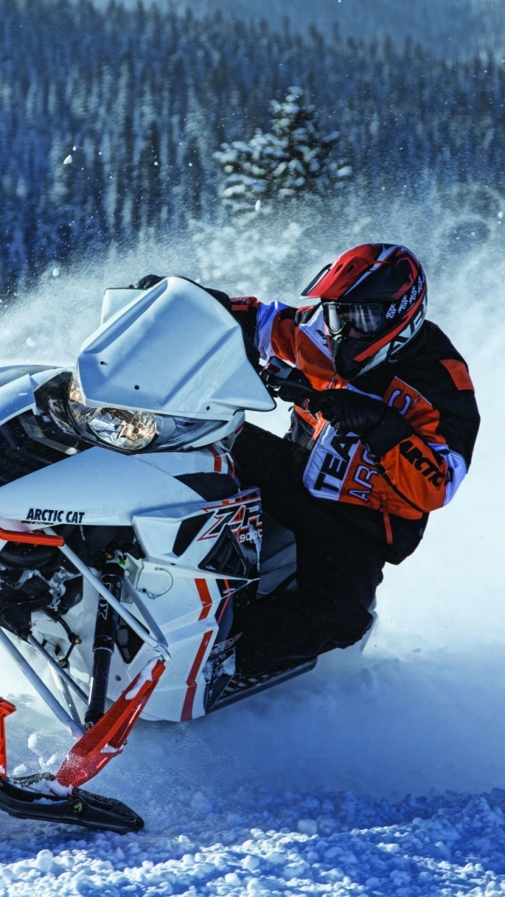 Man in Black and Red Jacket Riding Snow Mobile. Wallpaper in 720x1280 Resolution