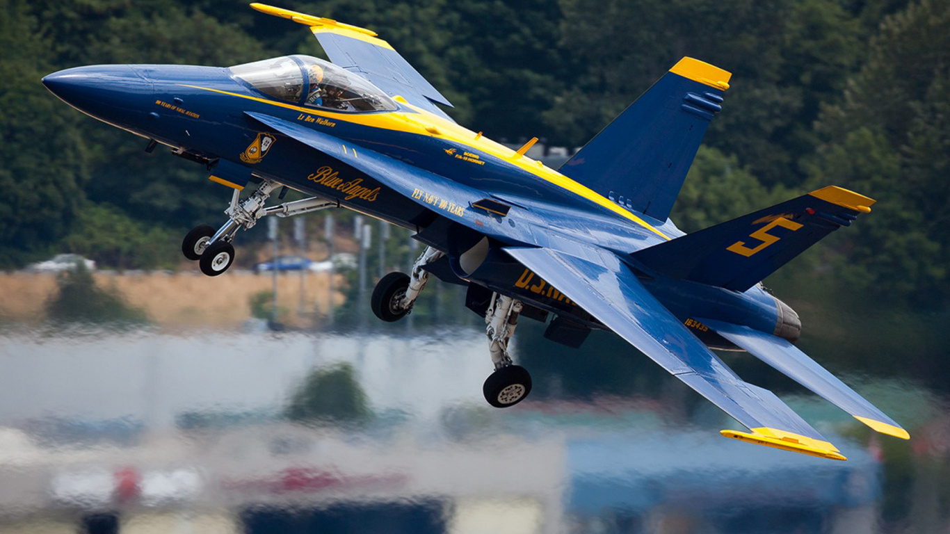 Blue and Yellow Jet Plane on Air During Daytime. Wallpaper in 1366x768 Resolution