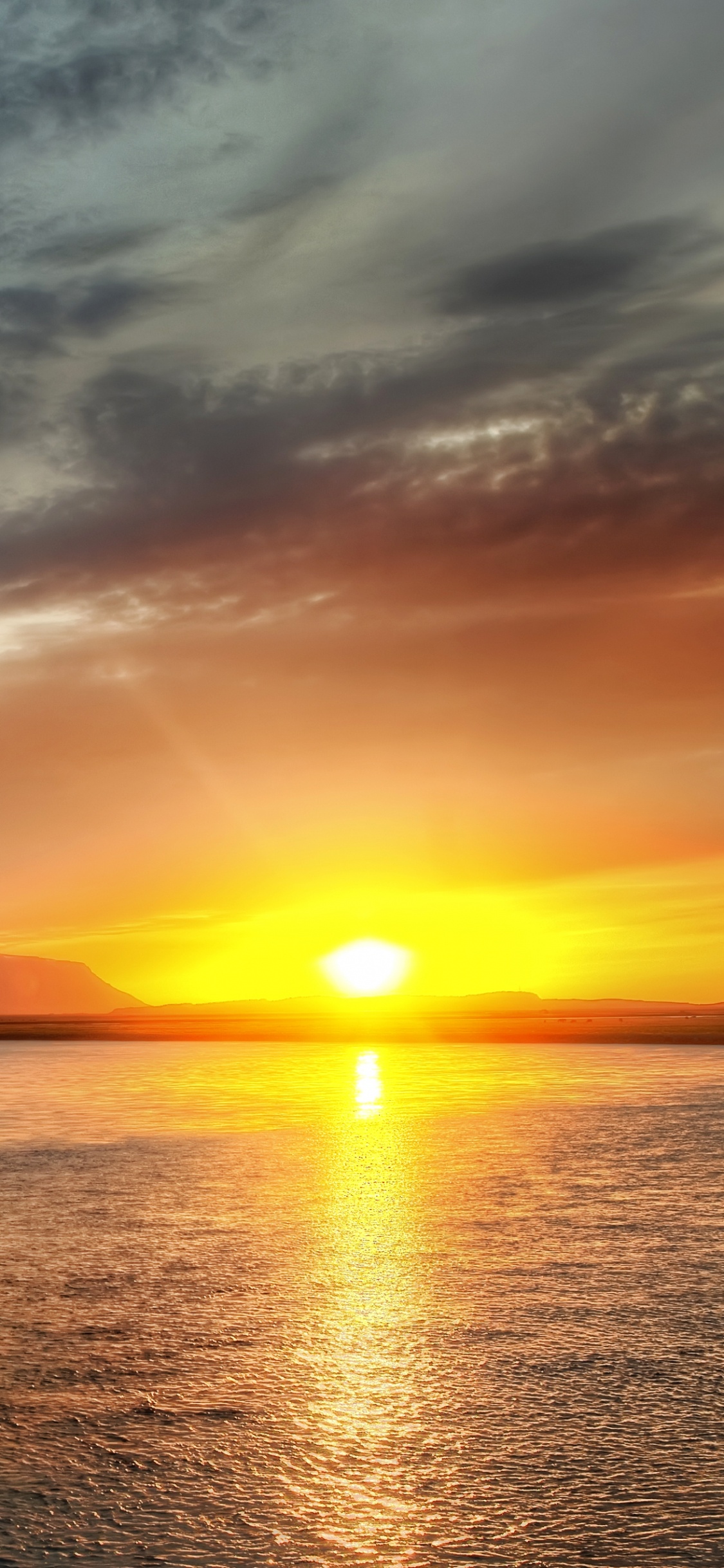 Body of Water During Sunset. Wallpaper in 1125x2436 Resolution