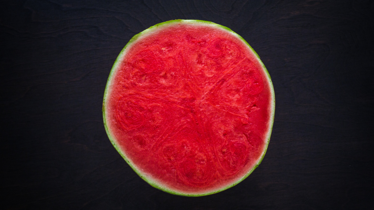 Sliced Watermelon on Black Wooden Table. Wallpaper in 1280x720 Resolution