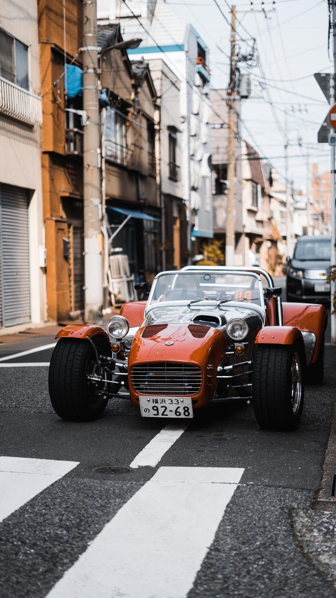 Orange and Black Car on Road During Daytime. Wallpaper in 1080x1920 Resolution