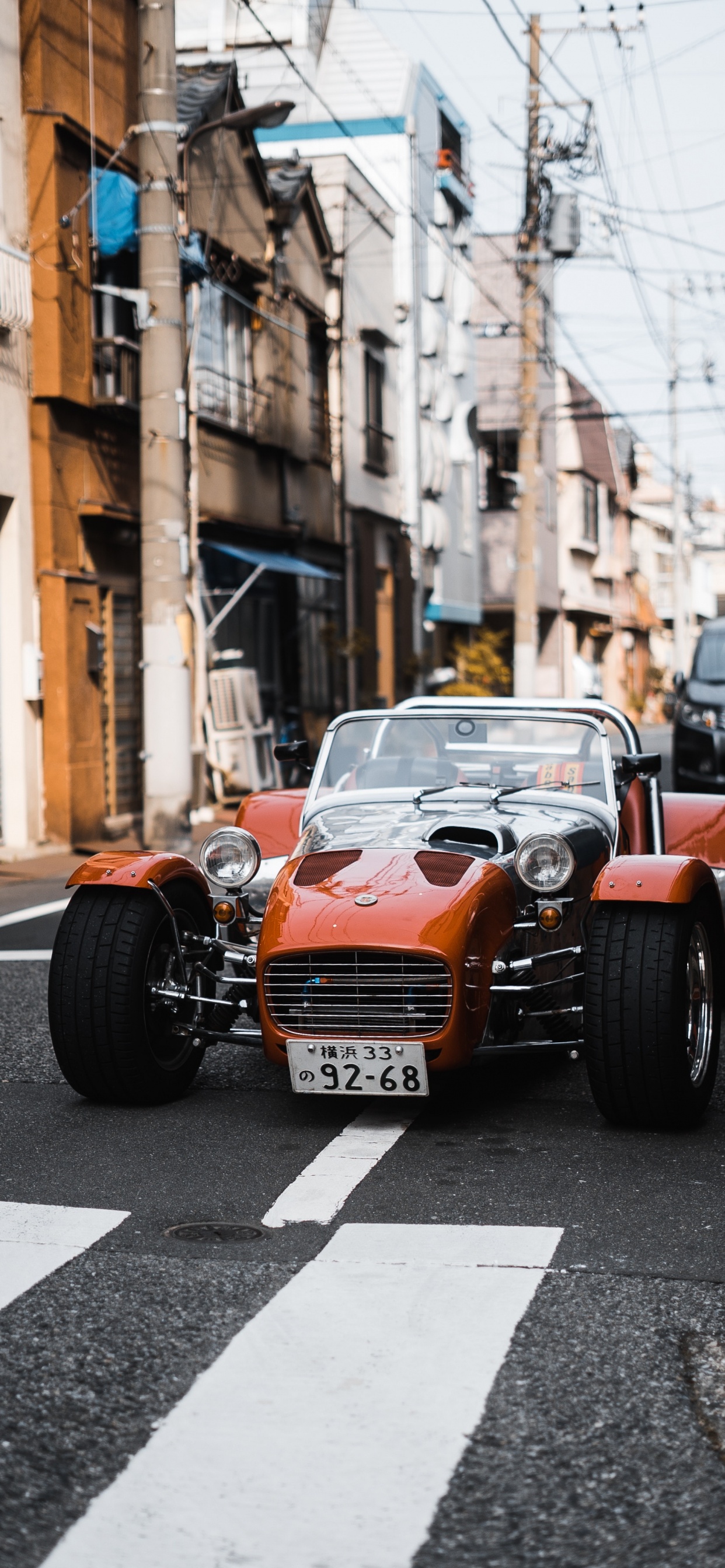 Orange and Black Car on Road During Daytime. Wallpaper in 1242x2688 Resolution