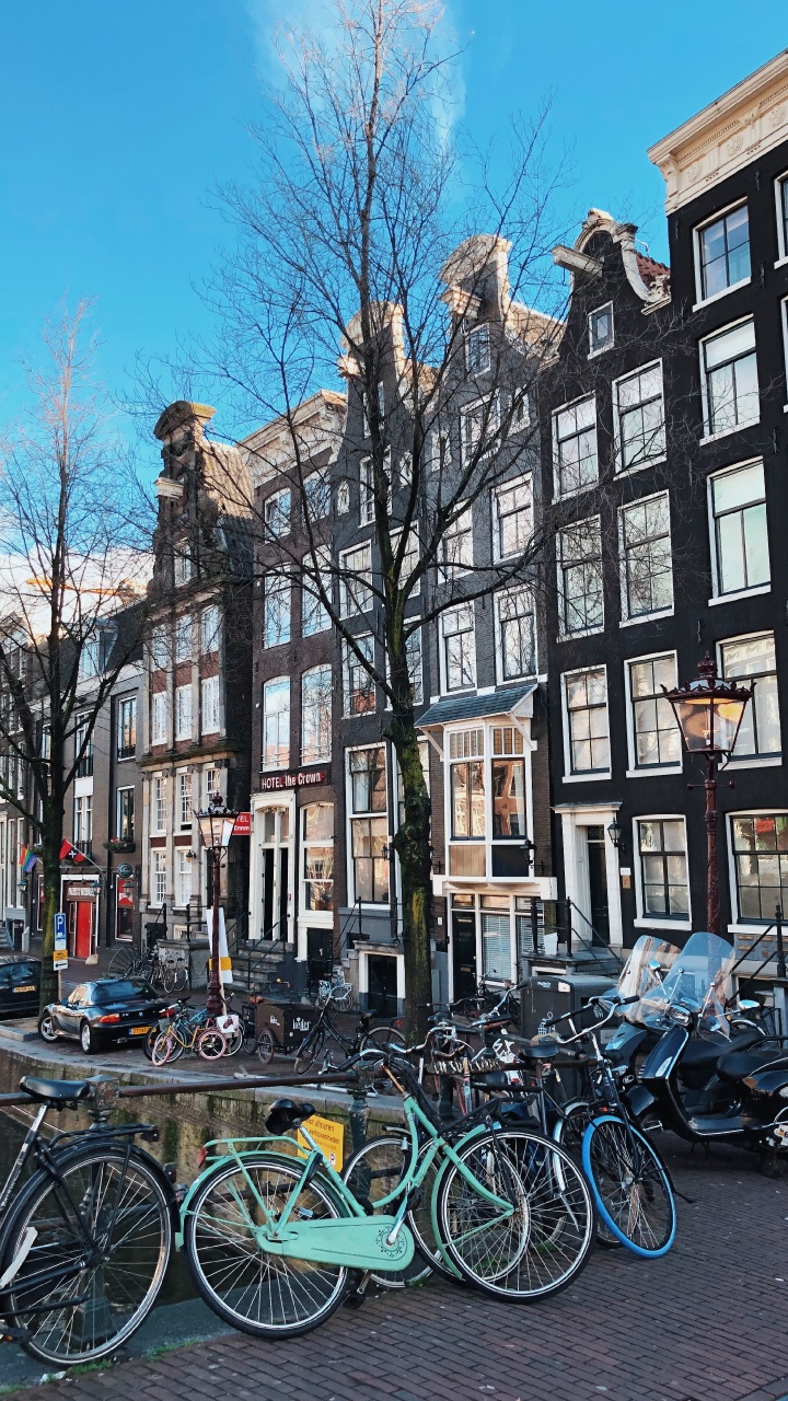 Bicycles Parked in Front of Building During Daytime. Wallpaper in 720x1280 Resolution