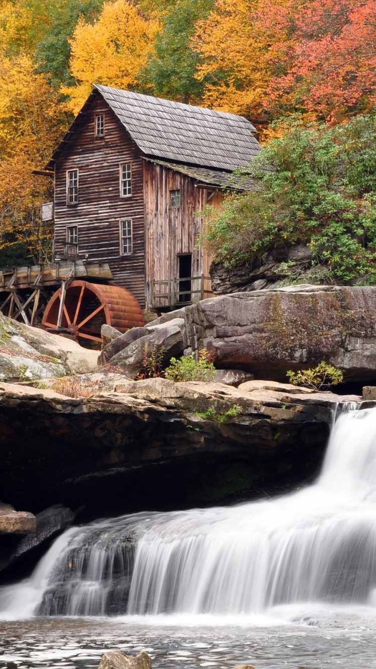 Brown Wooden House Near Waterfalls. Wallpaper in 750x1334 Resolution