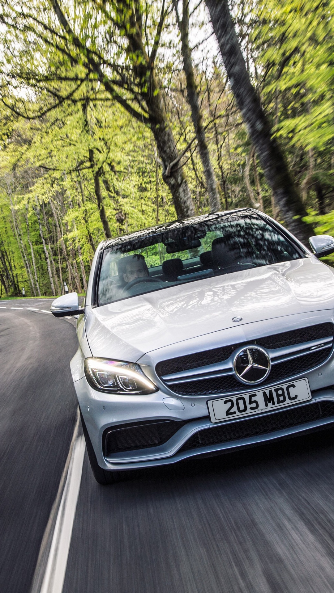 Silver Mercedes Benz Car on Road in Between Trees During Daytime. Wallpaper in 1080x1920 Resolution