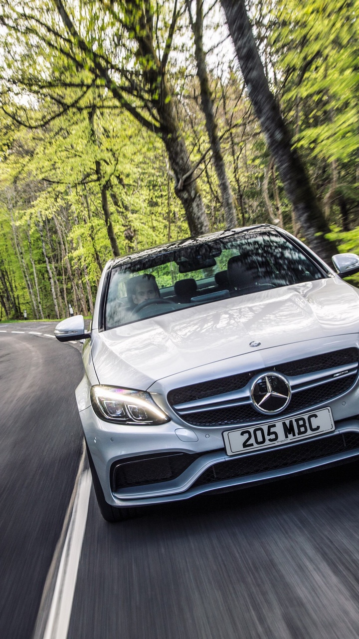 Silver Mercedes Benz Car on Road in Between Trees During Daytime. Wallpaper in 720x1280 Resolution