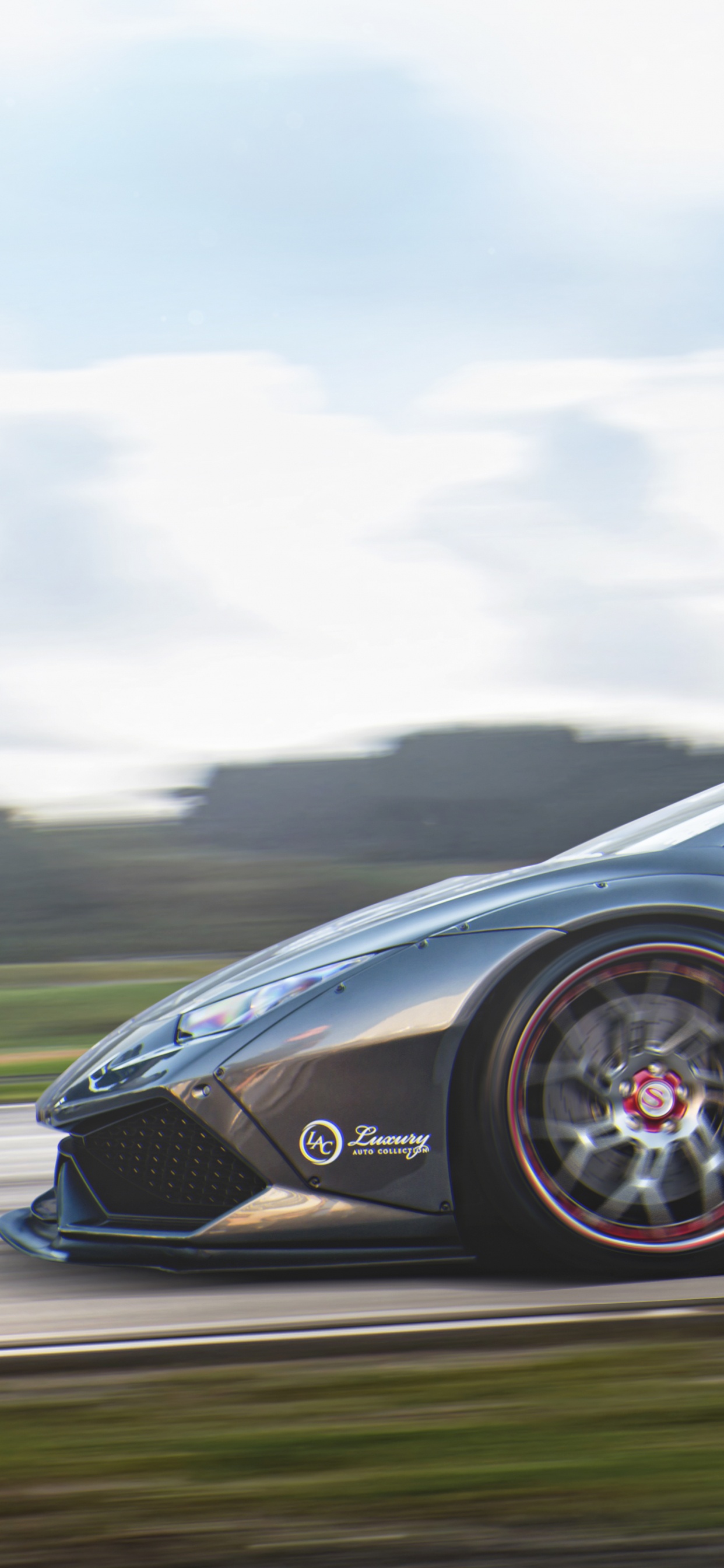 Black Porsche 911 on Road Under White Clouds. Wallpaper in 1242x2688 Resolution