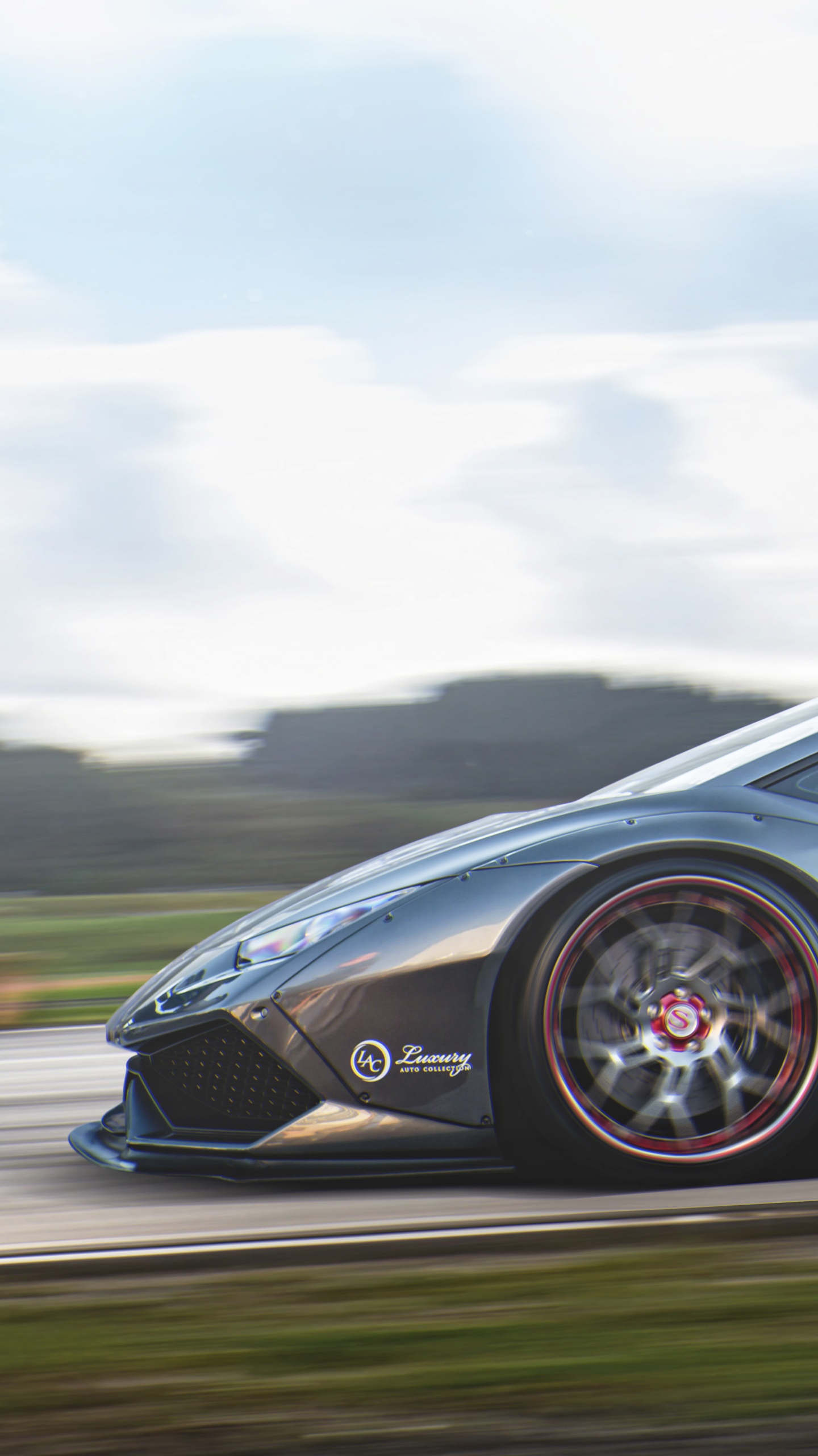 Black Porsche 911 on Road Under White Clouds. Wallpaper in 1440x2560 Resolution